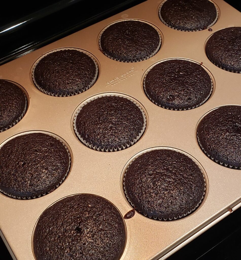 Perfectly moist and tender chocolate cupcakes fresh out of the oven